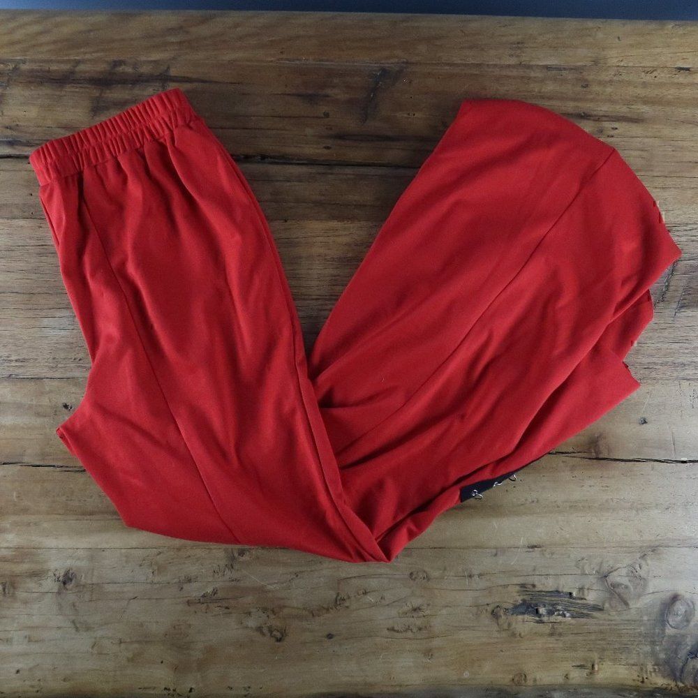 METROSTYLE RED PULL ON FLARE PANT WITH PIERCING DETAIL ON LEGS SIZE SMALL